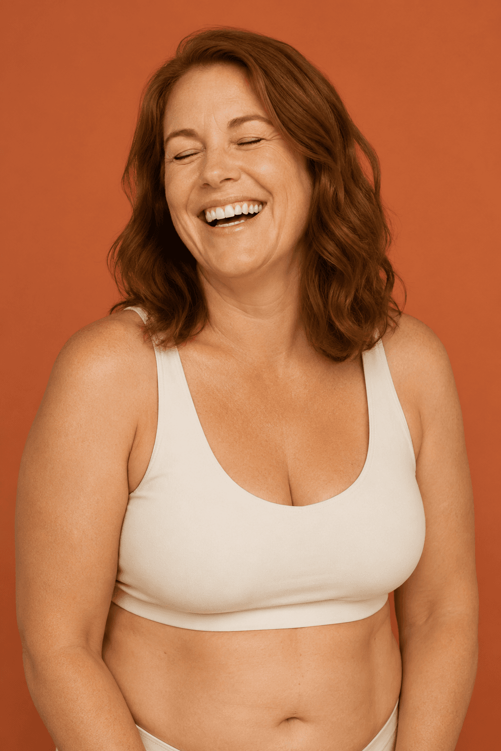 A laughing woman, comfortable in her body — exploring metabolic health on her own terms.