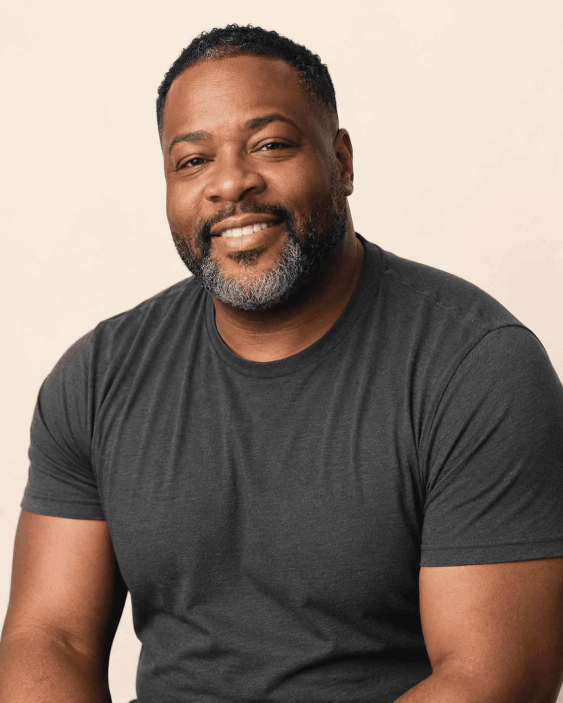 A man with a warm, easy smile — a reminder that this conversation is for everybody in the community.
